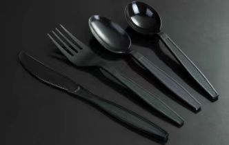 Black disposable knives, forks and spoons